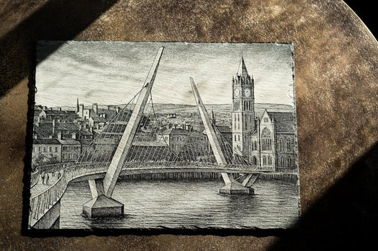Engraved slate artwork of Derry's Peace Bridge and Guildhall by Foyle Engraving Co